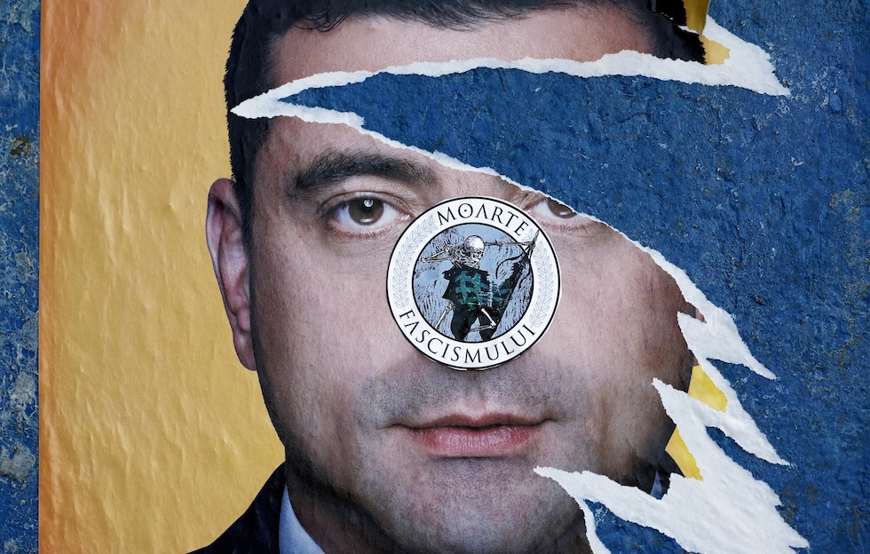 Un manifesto elettorale di George Simion, strappato